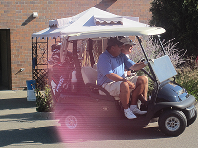 Men in a golf cart