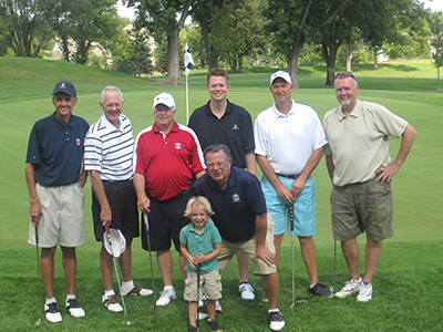 group shot of people on a golf course