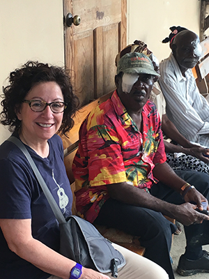 Cynthia, a MEC Ophthalmic Technologist, visiting with patients post-surgery