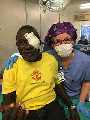 Cynthia helping a surgical patient