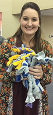 Woman holding dog toys