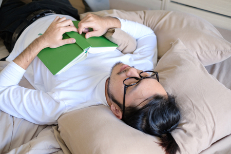 Man Sleeping with Glasses and Book