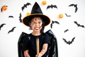 Young girl dressed up as a witch