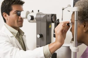 Ophthalmologist checking a patients' eyes