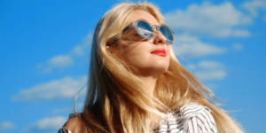 Woman in Sunglasses Looking at the Sky