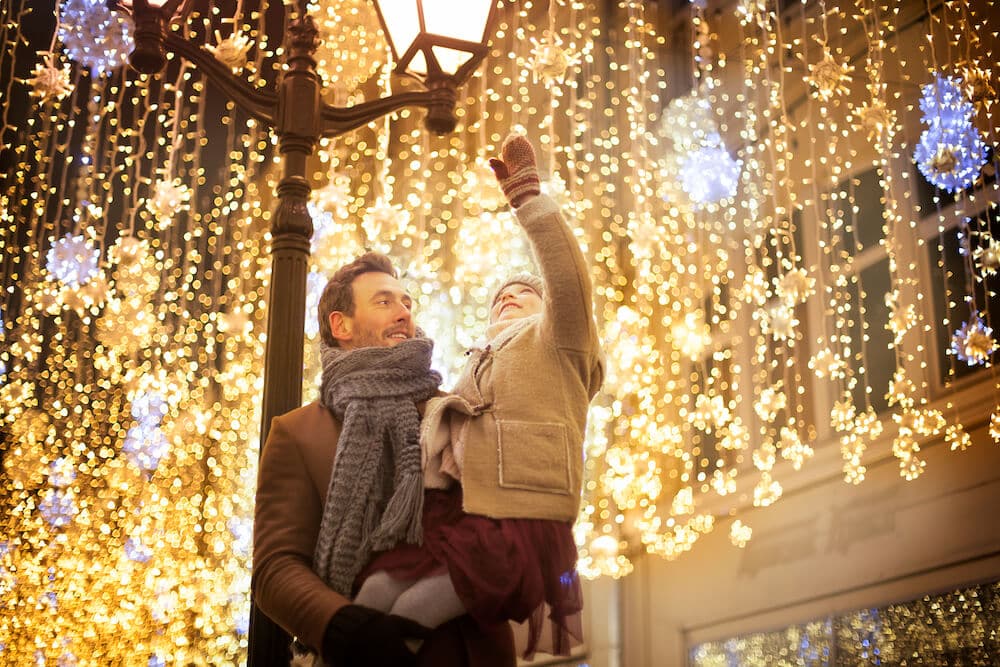 Family looking at holiday lights