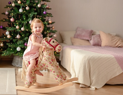 Holiday theme child on a rocking horse