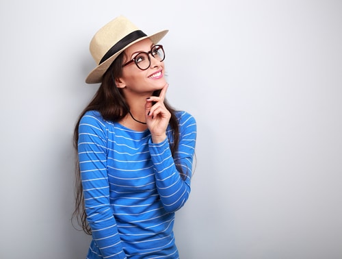 Woman wearing hat and glasses