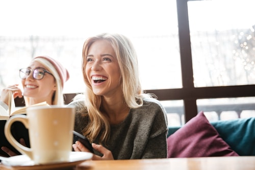 Laughing women with coffee