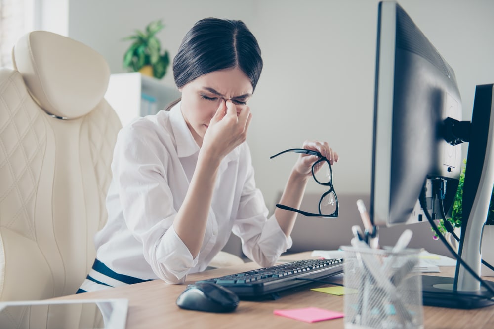 Woman dealing with computer eye strain